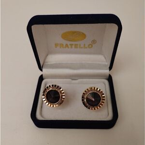 MEN'S FRATELLO GOLD WITH PURPLE STONE SURRONDED WITH RHINESTONES.